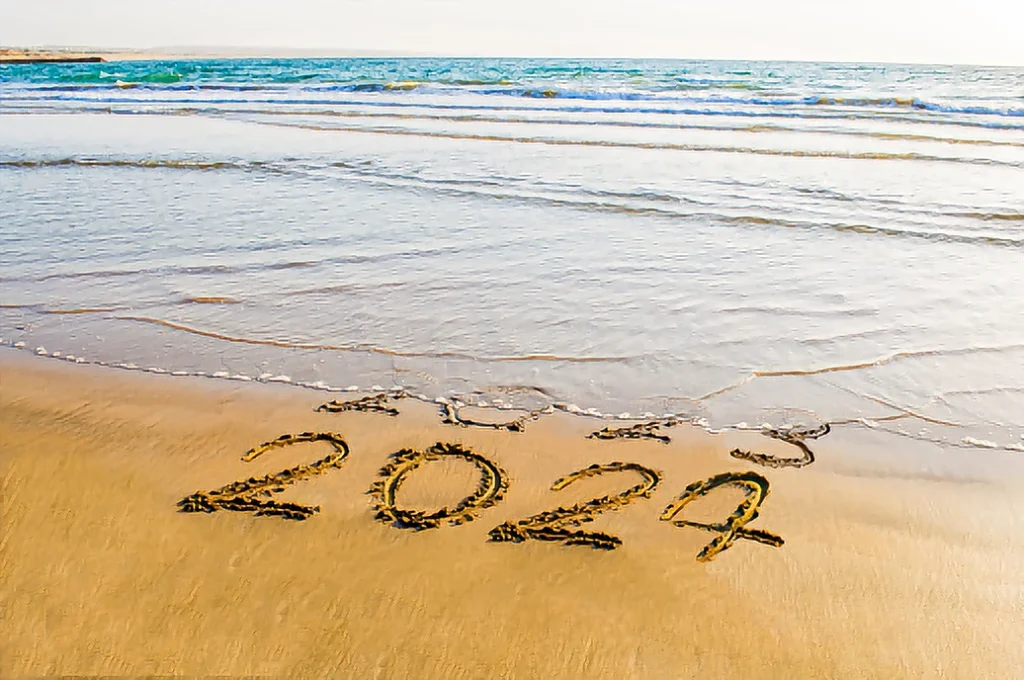 hand write 2023 2024 on sea beach