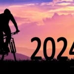mountain biker silhouette and happy new year 2024 photo