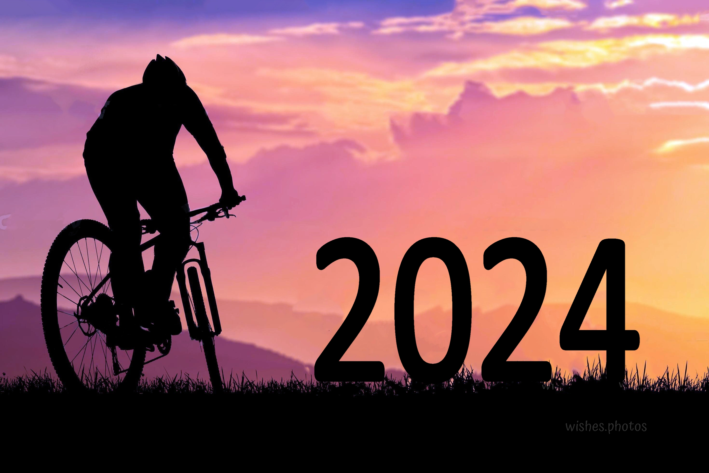 mountain biker silhouette and happy new year 2024 photo