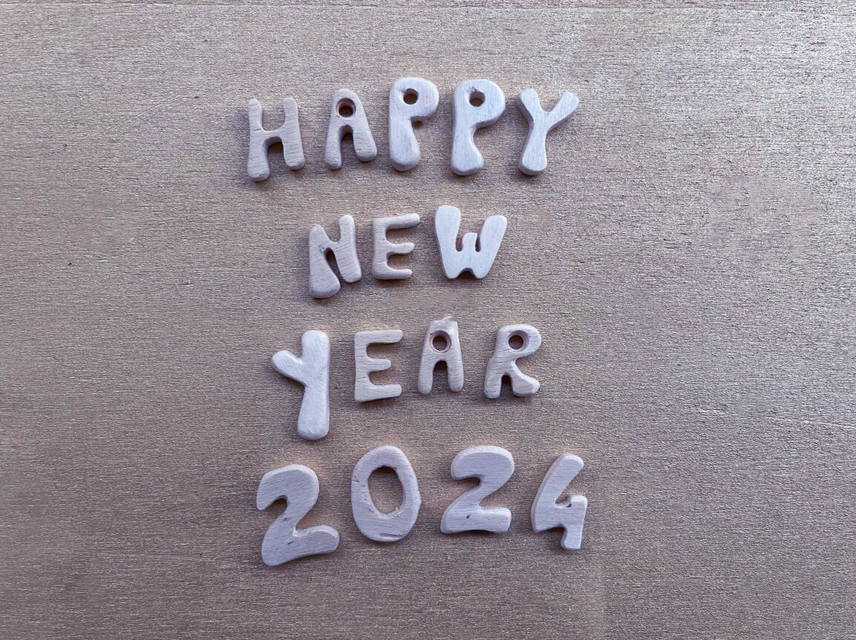happy new year 2024 with wooden letters and numbers