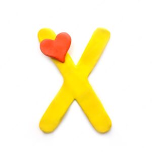 yellow plasticine letter x english alphabet with red heart meaning love 131240 1714