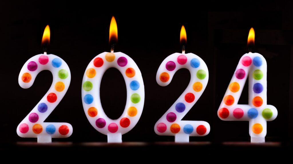 Colored candles write numbers flame Happy new year 2024 wishes.photos