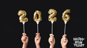 Female Hands with Figure 2026 Made of Foil Balloons on Black Background