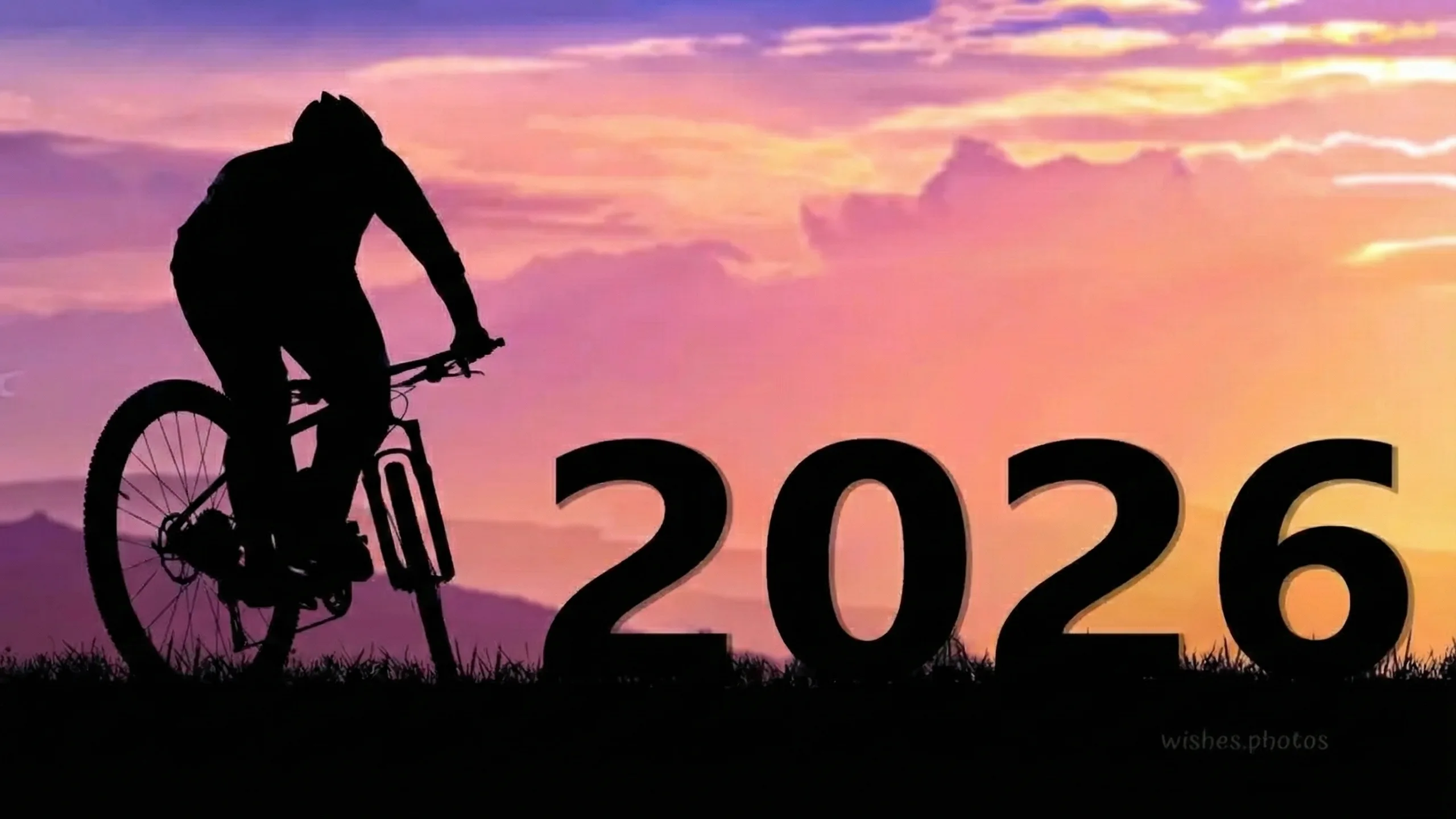 mountain biker silhouette and happy new year 2026 photo mountain biker silhouette and happy new year 2026 photo