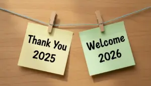 Thank You 2025 and Welcome 2026 image A Conceptual New Year Transition Photograph Featuring Sticky Notes on a Clothesline Against a Rustic Wooden Background